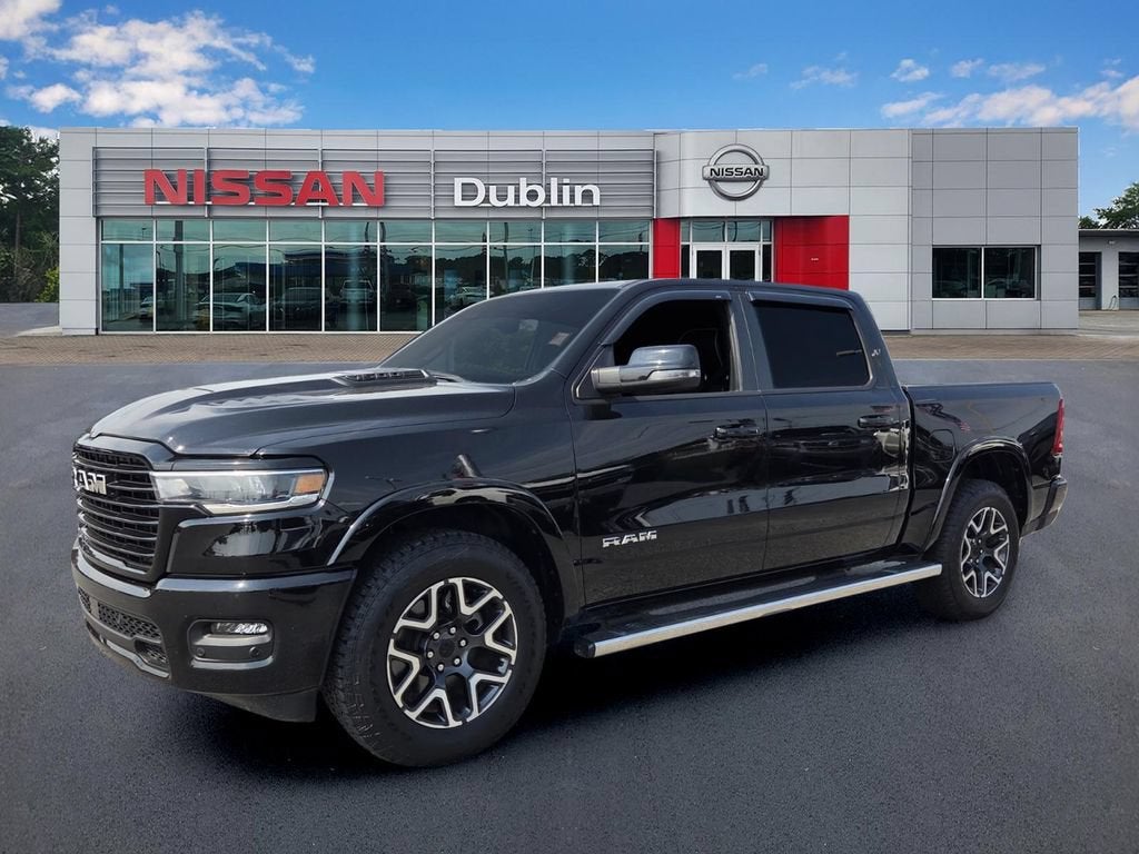 2025 RAM 1500 Laramie in Black — front three-quarter view