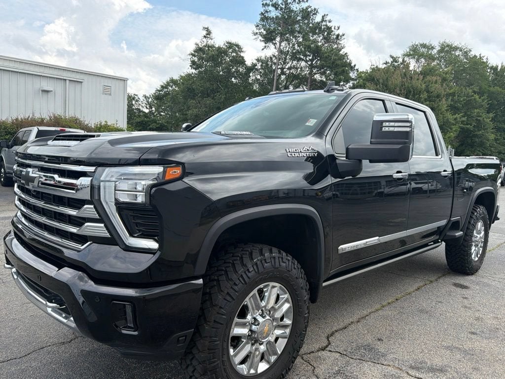 2024 Chevrolet Silverado 2500 HD High Country in Black — front three-quarter view